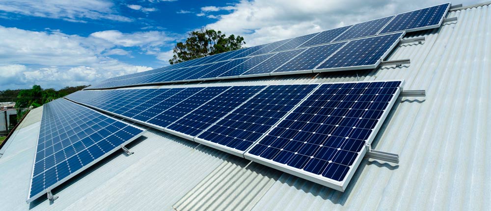 30KW solar power panels on roof of Abalone Aquasuits factory.